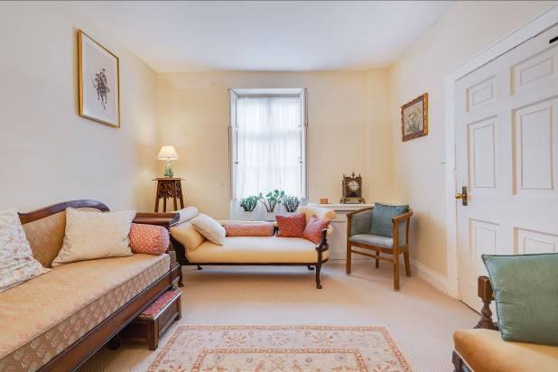 A charming house full of history and period features, and with a small courtyard garden to the rear.