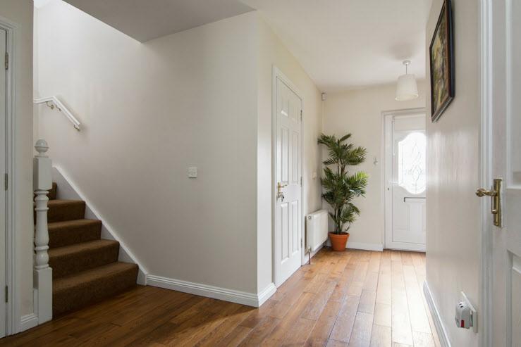 The Property Comprises: upvc front door with double glazed insets to... ENTRANCE HALL: Engineered wood floorboards. Storage under stairs.