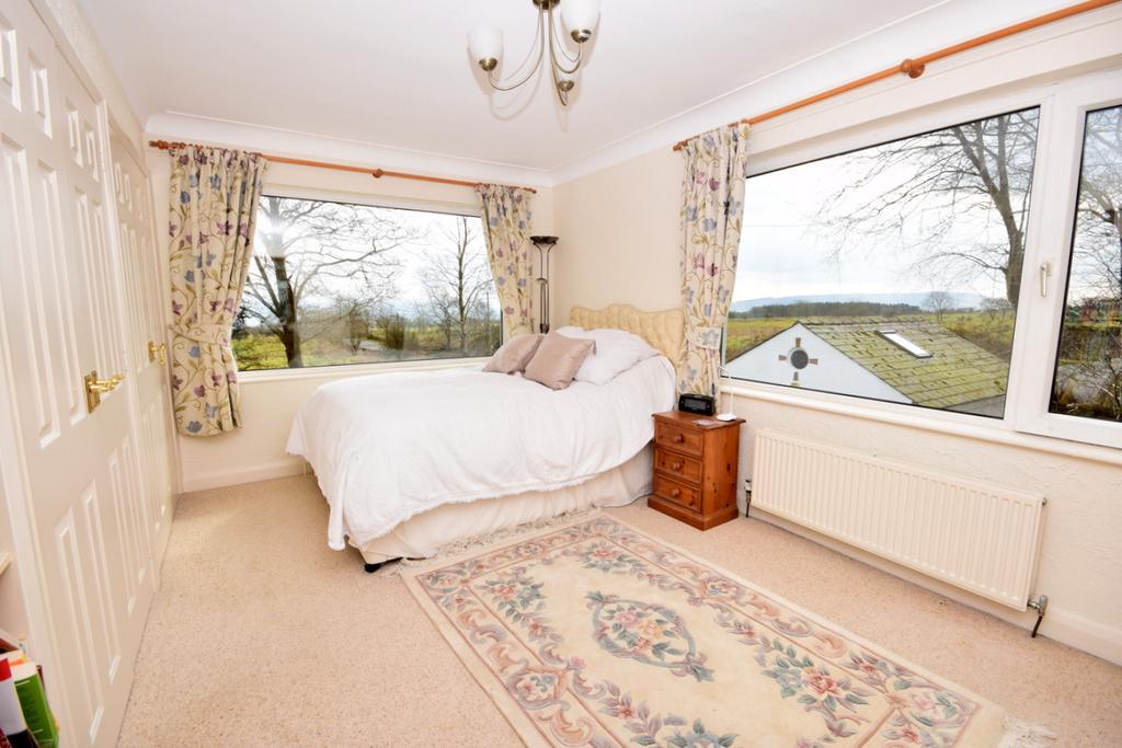 Access all the way round the house leading to a rear garden with decked patio and outlooks