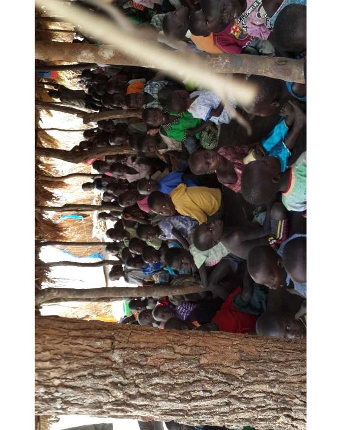 Apicture taken in 2016 of children in a makeshift classroom in Rwamutonga IDP camp, after over 250 families were