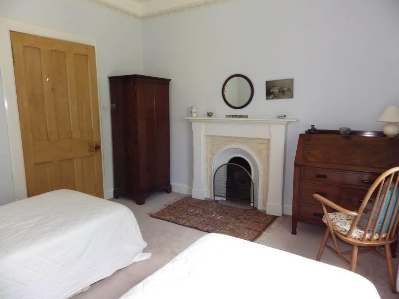 ) This further bedroom has a window, cupboard with
