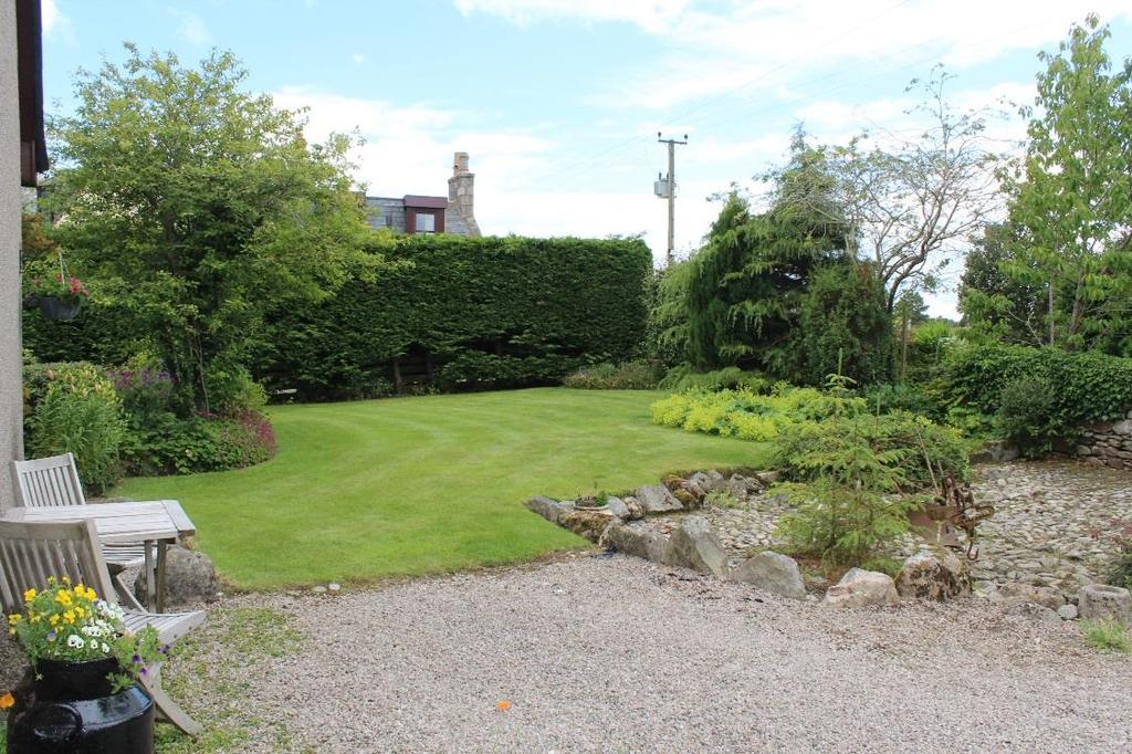 GARDENS: The extensive gardens which surround the property have been attractively landscaped