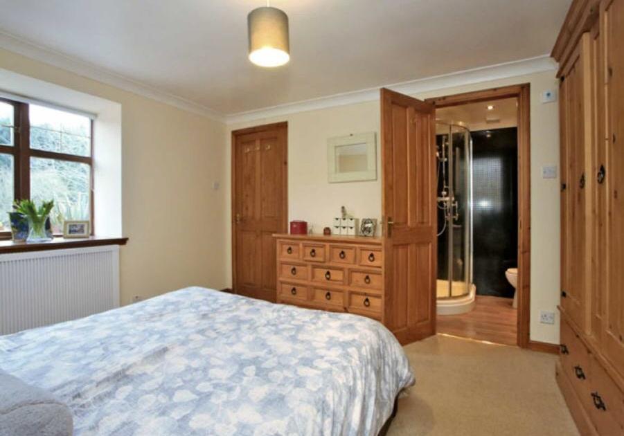 61m) Spacious Master Bedroom to the front of the property,