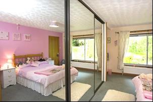 86m This is a generous bedroom which again includes a fitted wardrobe with sliding mirror doors including comprehensive storage. There are windows to one elevation looking over the garden. Radiator.