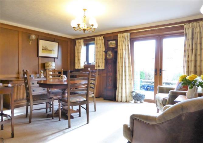 The property boasts a spacious layout, plenty of characterful features throughout such as solid beams, wood paneling and a multi fuel stove, sumptuous contemporary bathrooms,