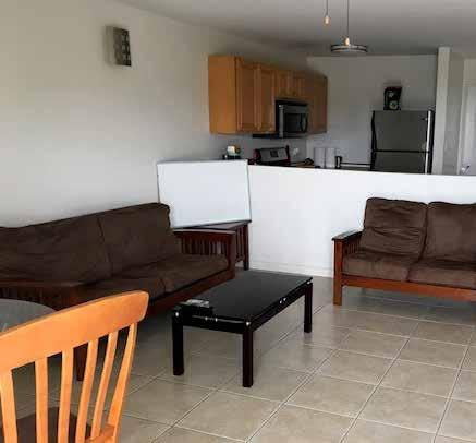 Villas also include an ample kitchen, open-plan dining and living areas, laundry washer/dryer with shelf space, and a charming fenced backyard grassland area.