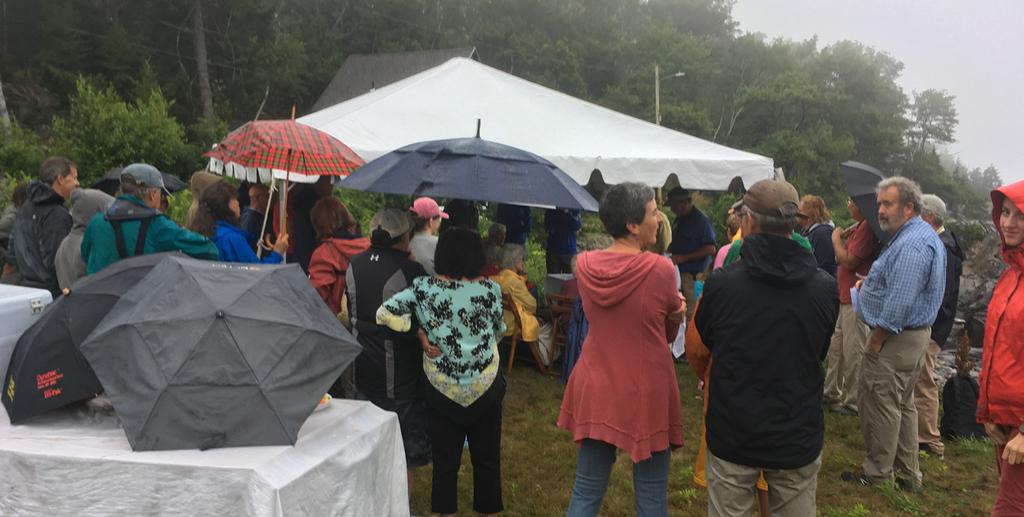 Nevertheless, a hardy group gathered under umbrellas at Peaks Land Preserve s community