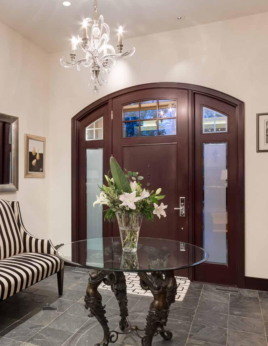 You Have Arrived Upon entering through the beautiful Cherrywood arched front door with a transom and