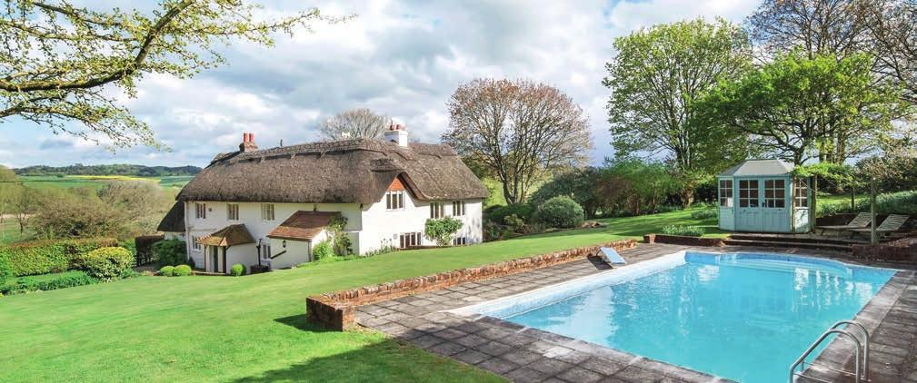 Outside The handsome, detached cottage is set within a mature garden totalling approximately 1 acre. The garden is mainly laid to lawn with well-established trees, shrub borders and flower beds.
