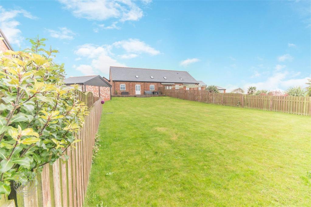 The property itself is located in an exclusive semi-rural gated development, just off Plodder Lane within 1 mile of junction 4 of the M61 motorway.