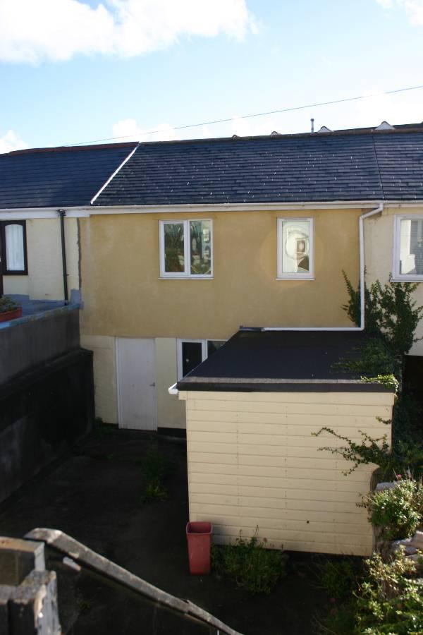 Rear two storey building: Back door from rear lane and covered passage way leading to: Inner yard area Garage/ workshop: