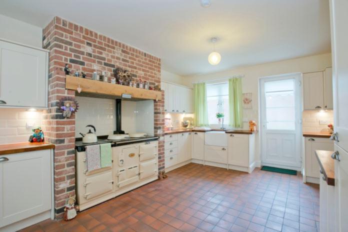4 KITCHEN/DINING ROOM The Kitchen is fitted with a good range of cream base units having wooden work surfaces over,