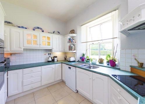 The kitchen and breakfast room give access through patio doors to the striking lawns and garden. A fully fitted kitchen with views over the gardens.