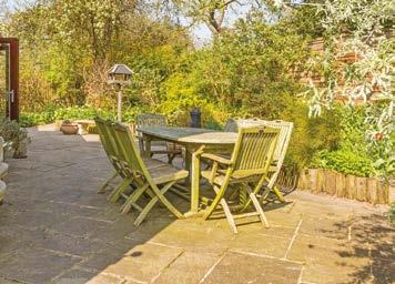 This space is ideal for small gatherings and summer BBQs.