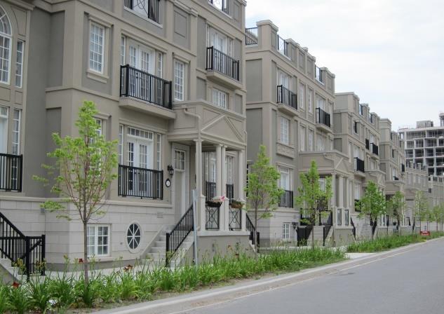 Stacked Townhouses - Blocks of attached units which are stacked one above the other and oriented to the street.