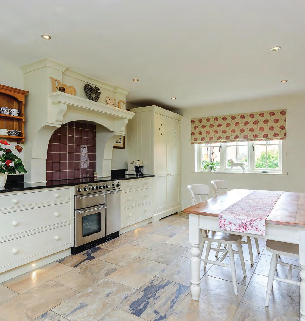 The dining kitchen is the real hub of the home and of a superb size with ample granite work surfaces, a range of handmade units, a Rangemaster oven with extractor fan above,