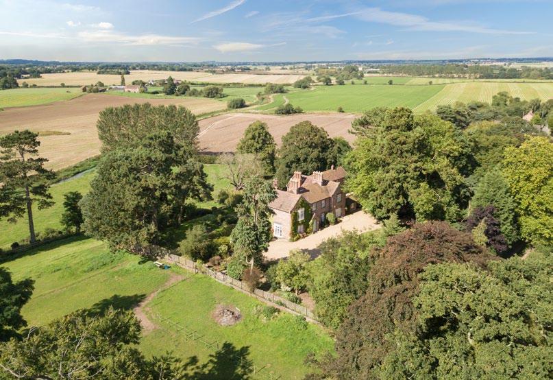 The Old Rectory Great Bolas, Shropshire, TF6 6PQ A fine country house standing in mature gardens with unspoilt far reaching views. Equestrian facilities and land extending to about 3.90 acres (1.
