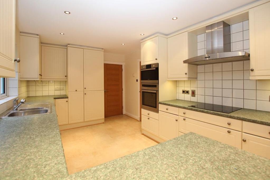 Kitchen/dining room 26 2 x 9 8 Fitted cream units with granite effect work surface incorporating a 1 ½ bowl sink and drainer unit. Window and fully glazed double doors to rear.