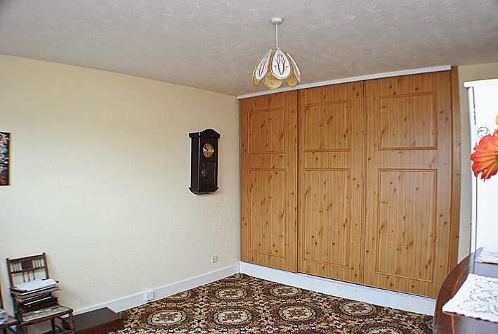 BEDROOM 1 Window to front with curtain track and curtains, fitted carpet, central heating radiator, ceiling light, additional telephone