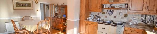 kitchen cabinets with polished granite worktops