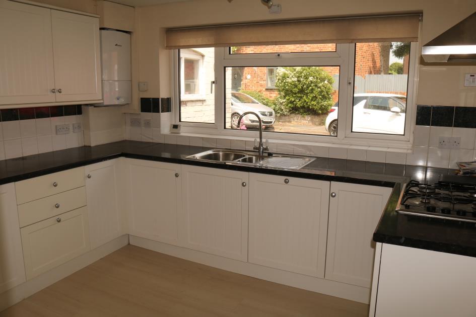 Kitchen measuring approximately 11 3 x 9 3 (3.42 x 2.81 m) side elevation double glazed windows. Range of fitted units comprising, worktop surfaces draws and storage cupboards under.