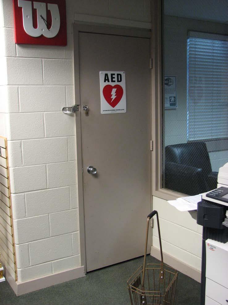 A.C. NIELSEN TENNIS CENTER ADA STANDARD: 4.13.9 Door knob on first floor AED closet room door is round and hard to grasp.