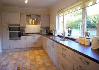 77m) An excellent facility with double glazed window and door to rear courtyard. Understairs cupboard. Fitted base unit. Single bowl stainless steel sink unit with mixer tap. Combi boiler.