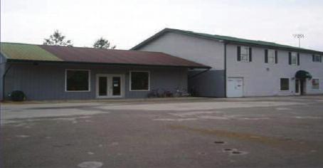 5 baths and 2 apartments upstairs, and 1-3600 sq. ft. garage w/4 doors,.5 bath, lift and more. KU and city utilities.
