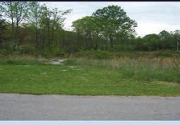 MLS #93103, 93105-93112 BAKER RIDGE ROAD One acre - two lots with 150 frontage each.