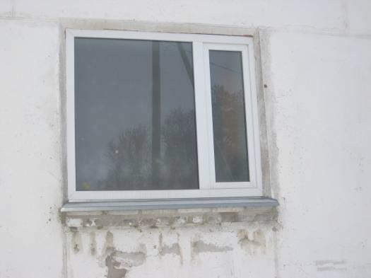 Photos. Examples of old wooden framed and new plastic windows.