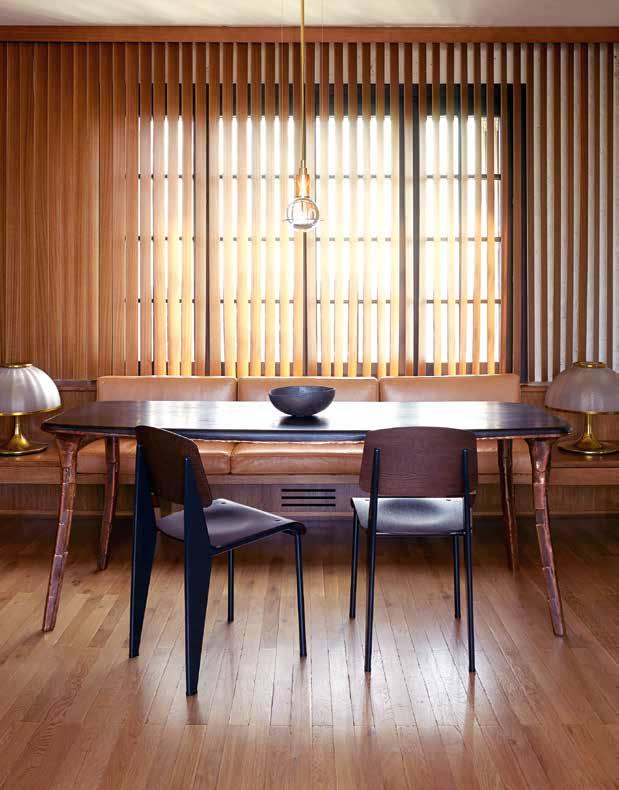 With calming, filtered light, it features a table by Valentin Loellmann, from Galerie Gosserez; vintage dining chairs by Jean Prouvé; a Günther Leuchtmann pendant from Tecnolumen; and a Shizue Imai
