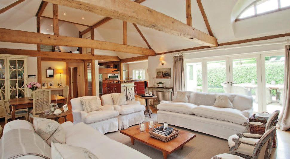 Surrounded by nearly 3 acres of land and gardens, the house has comfortable and light space, yet retains the character of the property, such as the oak beams and thatch.