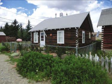 130 and 140 8 th Street: These two properties are a pair of log cabins built in 1934.