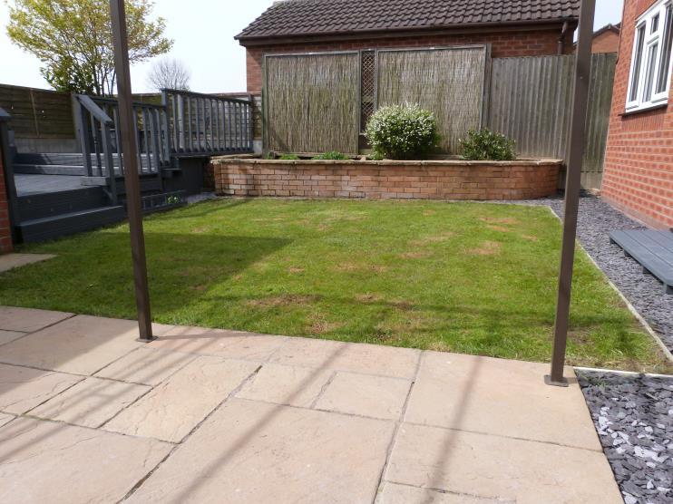 Predominately laid to lawn with adjoining paved patio.