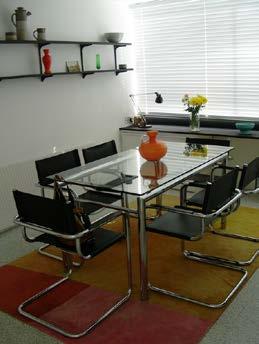 Dining Room Table 750 mm high with leather and chrome chairs 430 mm high with narrow arm rests Ceiling light as