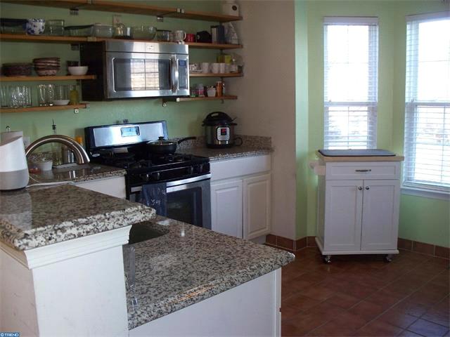 The Eat in Kitchen boasts NEW Granite Counters and sink, all newer appliances,tile flooring, and a large Pantry.