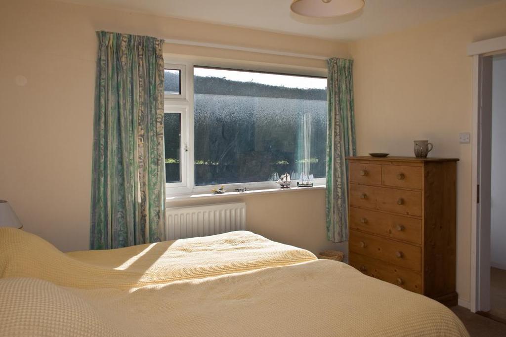 BEDROOM 4 11ft 2" x 10ft 6" South facing upvc double glazed window with curtains and rail, ceiling light, power points, radiator.