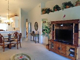 Kitchen is fully equipped and includes pantries and breakfast area. A formal dining area is adjacent to living room.