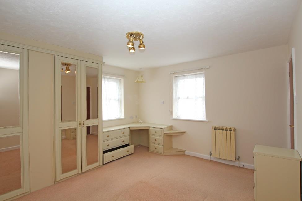 with a 3 piece suite comprising corner bath, basin and wc.