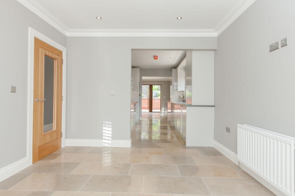 Property Comprises Composite entrance door with glazed top light. Leading to... HALL Marble tiled floor, understairs storage cupboard, recessed low voltage spotlights.