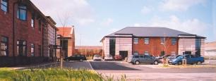 storey detached office buildings, constructed in load bearing brick/art stone