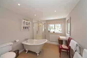 Outside From the lane a five-bar gate opens to the gravel entrance drive up to the parking and turning areas beside the house and