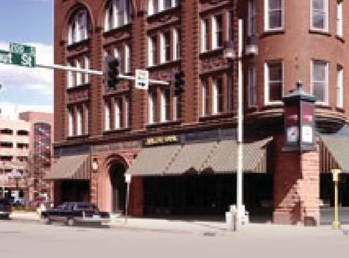For its role as a significant, local example of Romanesque architecture, the William Brown Building was recognized with a listing on the National Register of