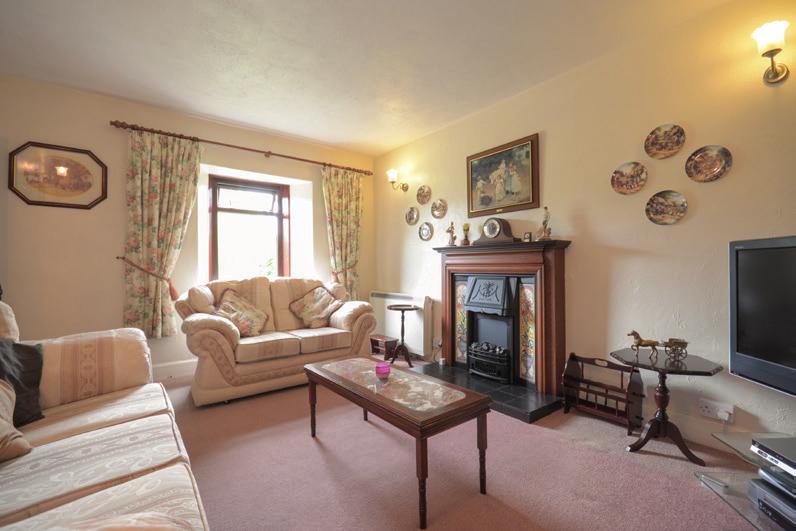 From here you walk into the living room which of good proportion with fireplace and door to the hallway and two double bedrooms currently bedrooms four and five in size.