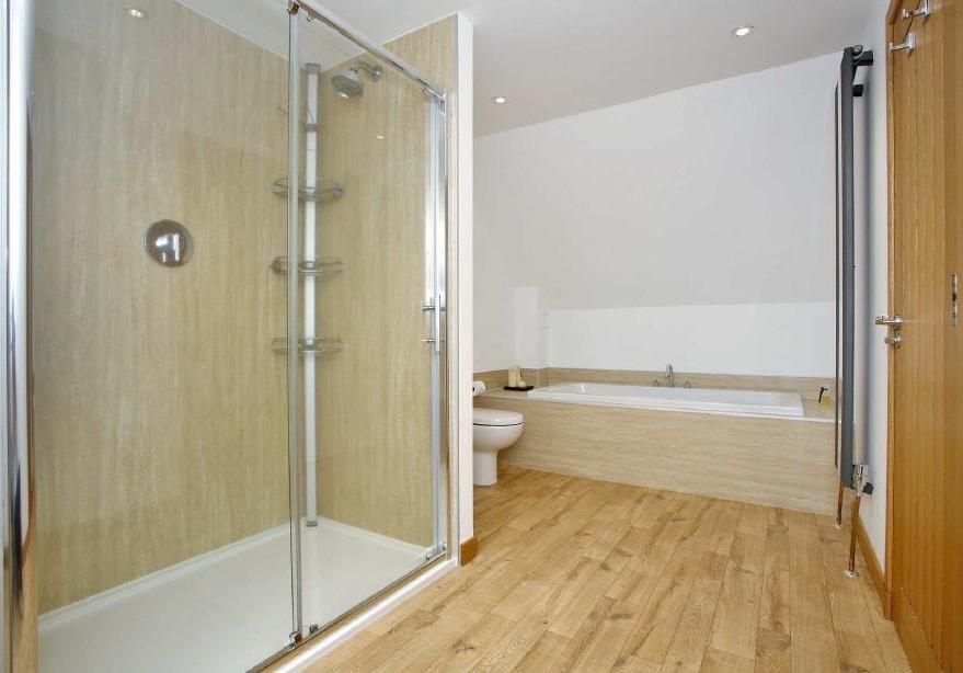 36m (15'2" x 7'9") A generous bathroom comprising large extra deep bath, double sized shower cubicle,
