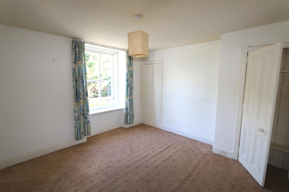 Two basic cupboards and window to rear. Bedroom 3/Lounge - measuring 3.63m x 3.46m or thereby with electric storage heater.