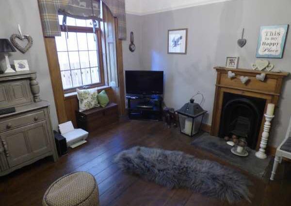 slate hearth and stripped and varnished flooring.