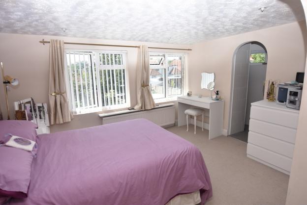 76m) Incorporated in the bedroom is a dressing area with two larger than average wardrobes with hanging and shelving.
