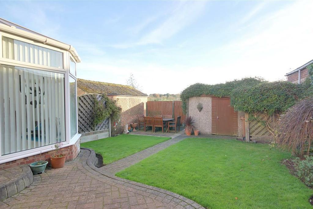 OUTSIDE A low brick wall runs to the front of the property and a block set driveway and forecourt provide