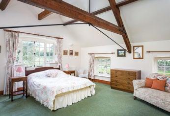 Bedroom 1: 5.96m (19ft 7in) x 5.35m (17ft 7in) A superb room with apex ceiling and exposed beams. Windows to three sides of the room. Two radiators. Built in double wardrobe. Storage cupboard. T.V and phone points Bedroom 2: 3.